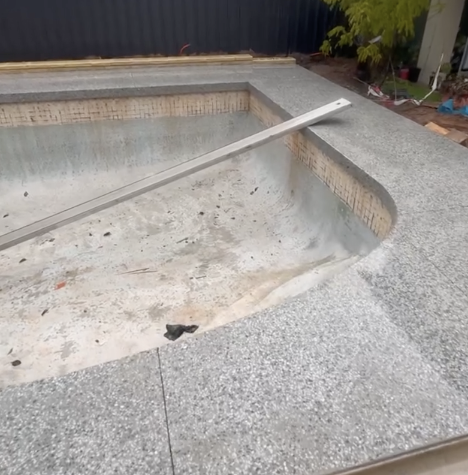 Honed concrete pool surround